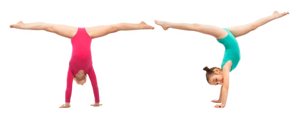 Coach Kaz Gymnastics students during a class